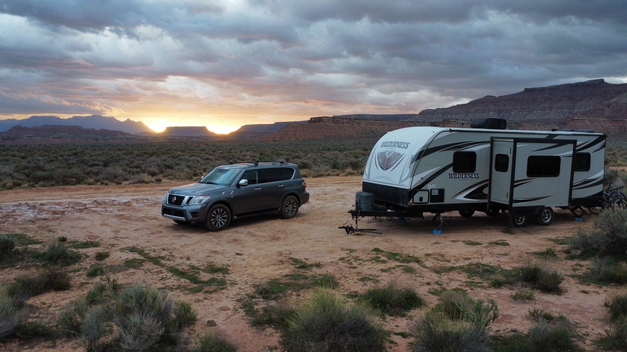 Truck and travel trailer camped at sunset